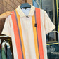 White Polo with Bold Vertical Stripes